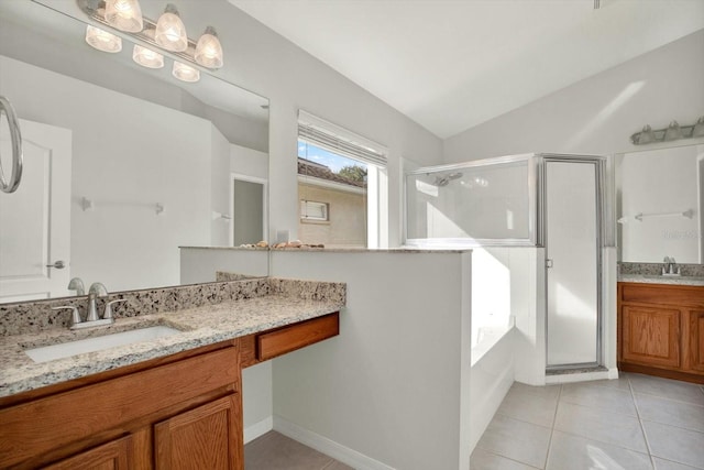 18419 Merseyside Loop, Land O Lakes, FL 34638 - full bathroom featuring a shower stall, tile patterned floors, vanity, a garden tub, and vaulted ceiling
