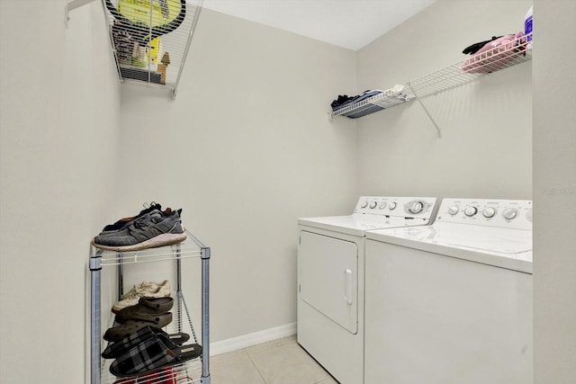 18419 Merseyside Loop, Land O Lakes, FL 34638 - laundry area with washer and clothes dryer and light tile patterned floors