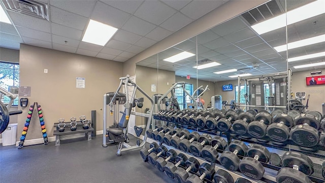 18419 Merseyside Loop, Land O Lakes, FL 34638 - exercise room featuring a drop ceiling and plenty of natural light