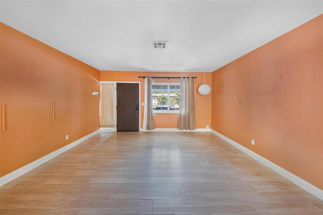 12995 NE 5th Ave, North Miami, FL 33161 - spare room featuring light wood-style flooring and baseboards