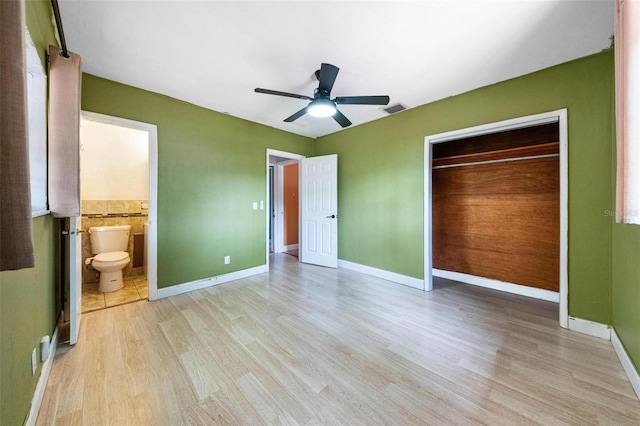 12995 NE 5th Ave, North Miami, FL 33161 - unfurnished bedroom with light wood finished floors, a closet, ceiling fan, and ensuite bathroom