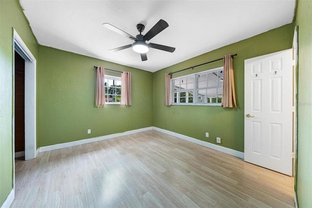 12995 NE 5th Ave, North Miami, FL 33161 - unfurnished bedroom featuring wood finished floors and ceiling fan