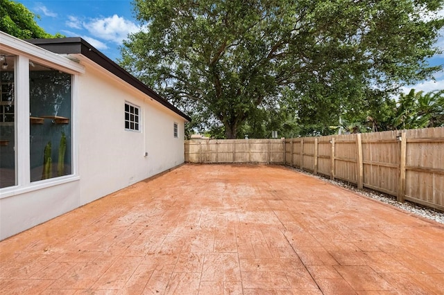 12995 NE 5th Ave, North Miami, FL 33161 - fenced backyard featuring a patio area