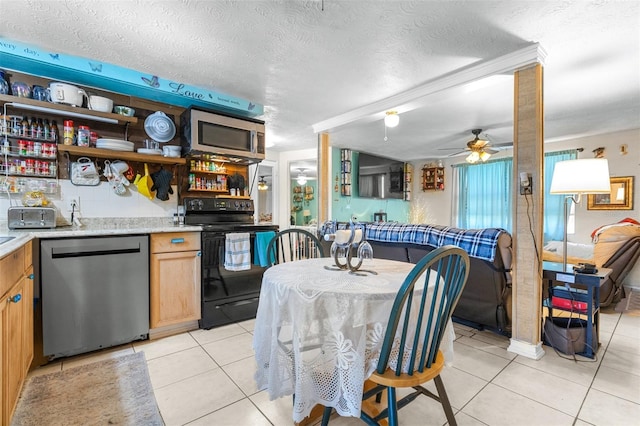 7441 Cypress Dr, New Port Richey, FL 34653 - dining space featuring light tile patterned flooring, a ceiling fan, and a textured ceiling
