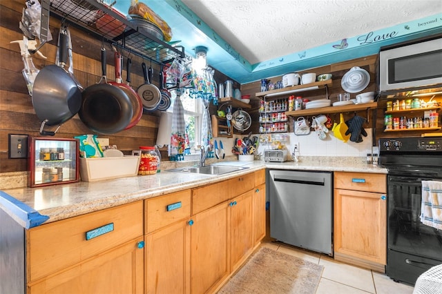 7441 Cypress Dr, New Port Richey, FL 34653 - kitchen featuring stainless steel appliances, open shelves, light tile patterned flooring, a textured ceiling, and light stone countertops