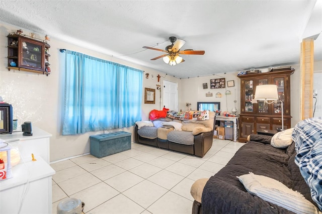 7441 Cypress Dr, New Port Richey, FL 34653 - living room with light tile patterned flooring, a ceiling fan, and a textured ceiling