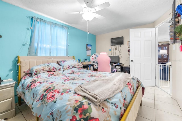 7441 Cypress Dr, New Port Richey, FL 34653 - tiled bedroom featuring a ceiling fan and a textured ceiling