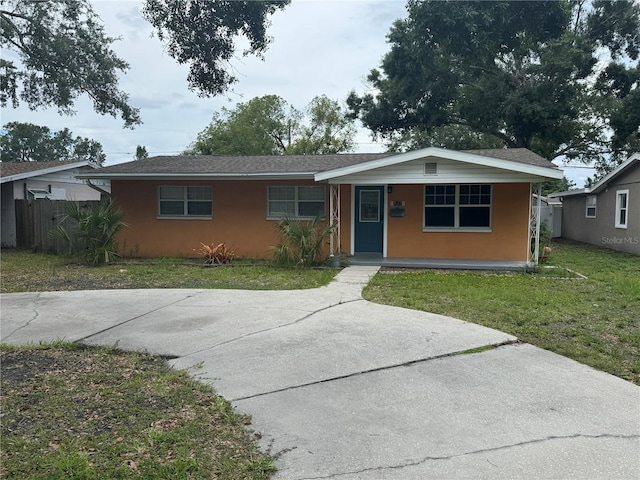 217 43rd Ave NE, Saint Petersburg, FL 33703 - view of front of property featuring a porch and stucco siding