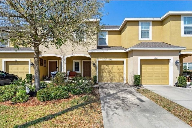 6909 Holly Heath Dr, Riverview, FL 33578 - view of property with stucco siding, a garage, concrete driveway, and covered porch