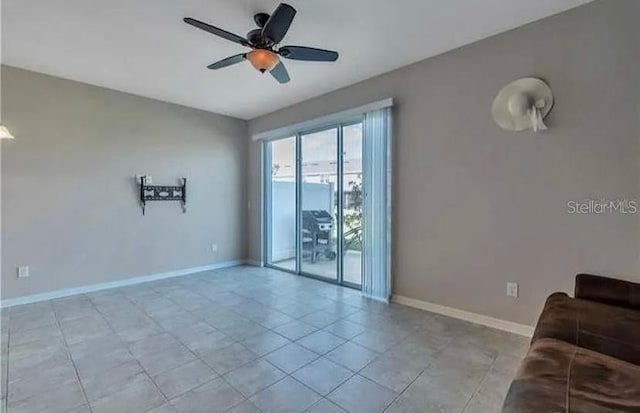 6909 Holly Heath Dr, Riverview, FL 33578 - living area featuring a ceiling fan and light tile patterned floors