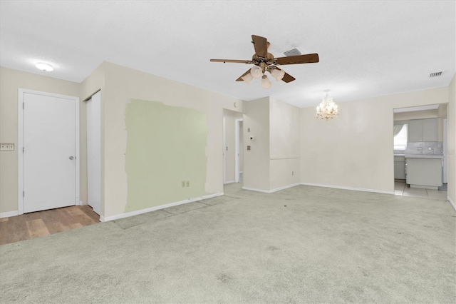 7000 Lafayette N, Pinellas Park, FL 33781 - carpeted spare room with ceiling fan and a chandelier