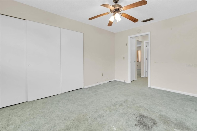 7000 Lafayette N, Pinellas Park, FL 33781 - unfurnished bedroom featuring carpet flooring, a closet, and ceiling fan
