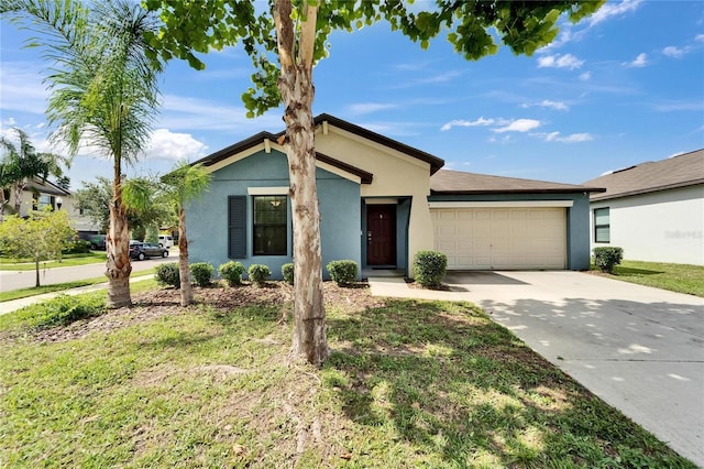 10119 Rose Petal Pl, Riverview, FL 33578 - view of front of property featuring stucco siding, an attached garage, and driveway