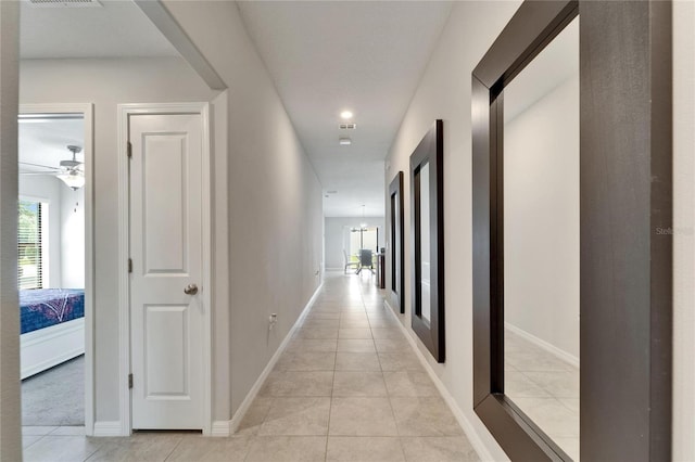 10119 Rose Petal Pl, Riverview, FL 33578 - corridor featuring light tile patterned floors and plenty of natural light