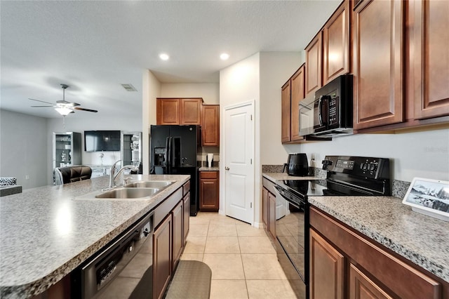 10119 Rose Petal Pl, Riverview, FL 33578 - kitchen with black appliances, ceiling fan, light tile patterned flooring, and recessed lighting