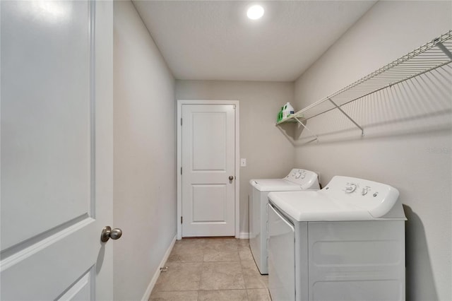 10119 Rose Petal Pl, Riverview, FL 33578 - laundry area with washing machine and clothes dryer and light tile patterned floors