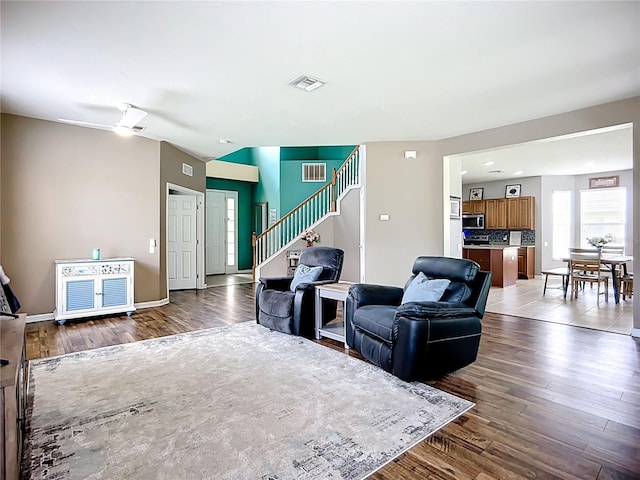5830 100th Ave E, Parrish, FL 34219 - living area featuring wood finished floors and stairway