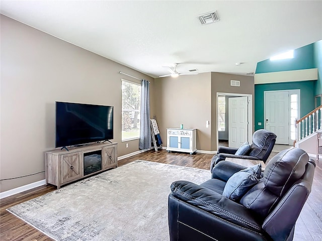 5830 100th Ave E, Parrish, FL 34219 - living room with wood finished floors, ceiling fan, and stairs