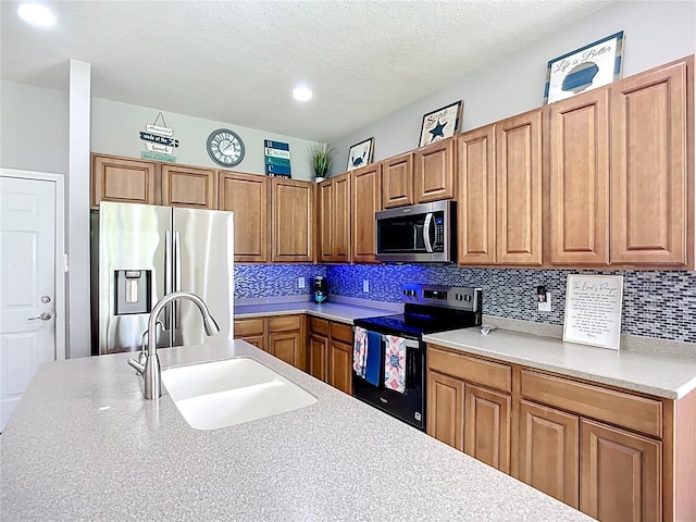 5830 100th Ave E, Parrish, FL 34219 - kitchen featuring stainless steel appliances, light countertops, backsplash, brown cabinetry, and a textured ceiling