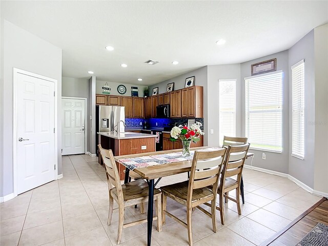 5830 100th Ave E, Parrish, FL 34219 - dining room with light tile patterned floors and recessed lighting