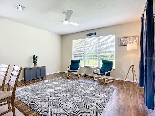 5830 100th Ave E, Parrish, FL 34219 - living area featuring ceiling fan and wood finished floors