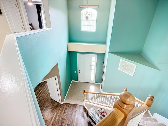 5830 100th Ave E, Parrish, FL 34219 - foyer with wood finished floors, stairway, and a high ceiling