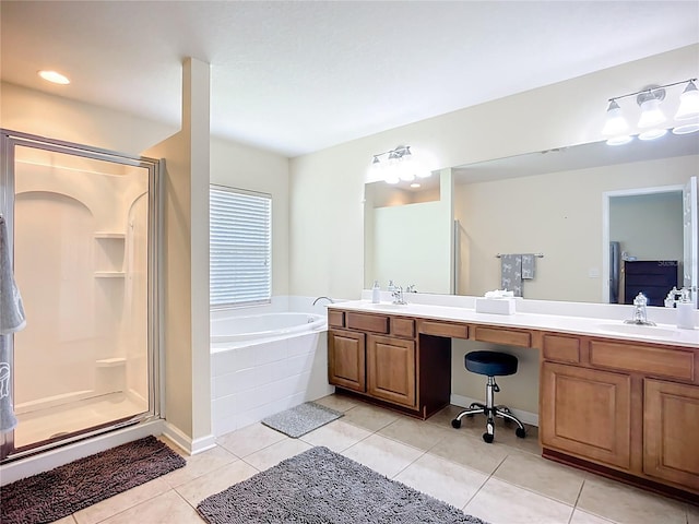 5830 100th Ave E, Parrish, FL 34219 - full bathroom with double vanity, a garden tub, a shower stall, and tile patterned flooring