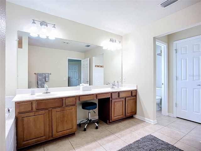 5830 100th Ave E, Parrish, FL 34219 - bathroom with double vanity and tile patterned floors