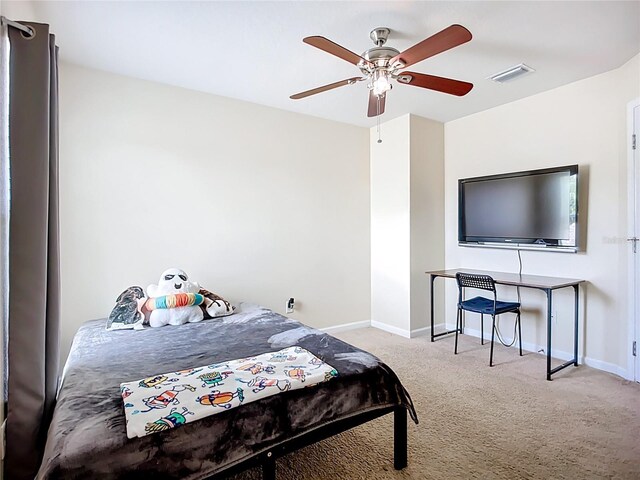 5830 100th Ave E, Parrish, FL 34219 - carpeted bedroom featuring baseboards and ceiling fan