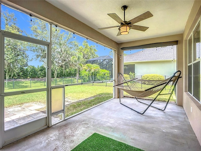 5830 100th Ave E, Parrish, FL 34219 - unfurnished sunroom with ceiling fan
