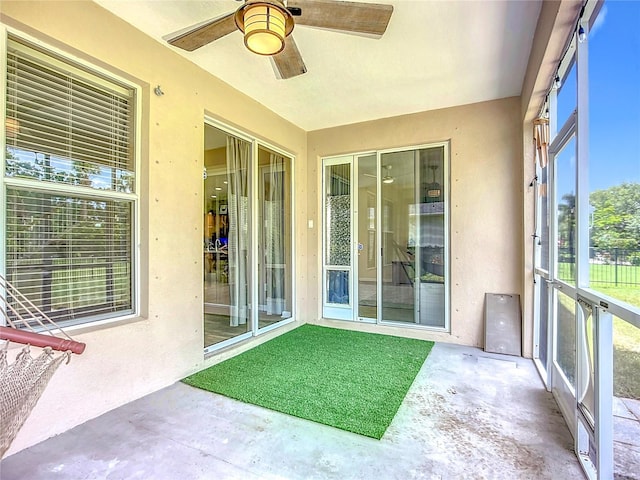 5830 100th Ave E, Parrish, FL 34219 - unfurnished sunroom featuring ceiling fan
