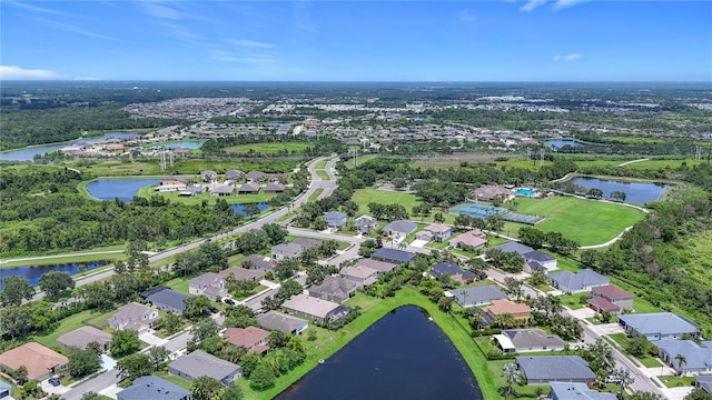 5830 100th Ave E, Parrish, FL 34219 - aerial view of property and surrounding area with a large body of water and nearby suburban area