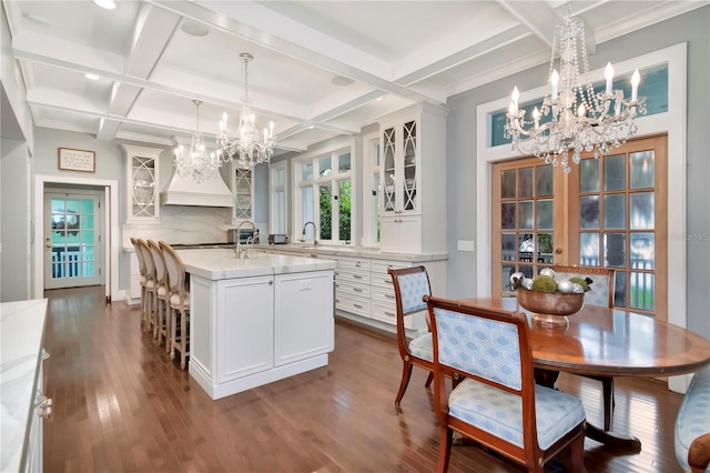 6220 Bayshore Blvd, Tampa, FL 33611 - dining area with a chandelier, coffered ceiling, dark wood-type flooring, and beam ceiling