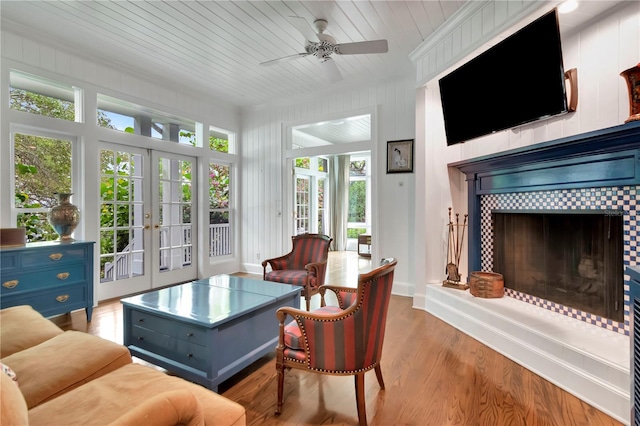 6220 Bayshore Blvd, Tampa, FL 33611 - living area with french doors, a fireplace, a ceiling fan, wood finished floors, and wooden ceiling