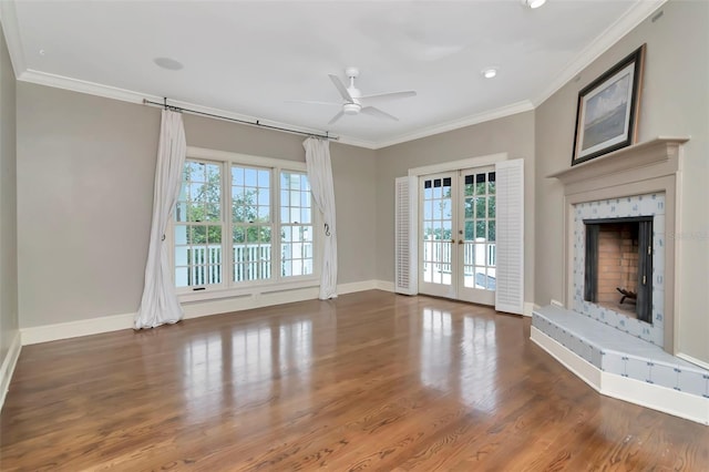 6220 Bayshore Blvd, Tampa, FL 33611 - unfurnished living room with crown molding, a ceiling fan, french doors, wood finished floors, and a fireplace