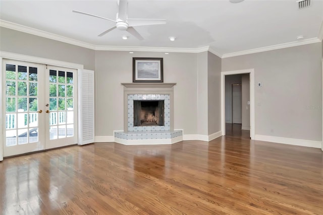 6220 Bayshore Blvd, Tampa, FL 33611 - unfurnished living room with ornamental molding, ceiling fan, wood finished floors, french doors, and a fireplace with raised hearth