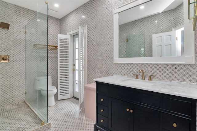 6220 Bayshore Blvd, Tampa, FL 33611 - bathroom featuring tile walls, vanity, and a tile shower
