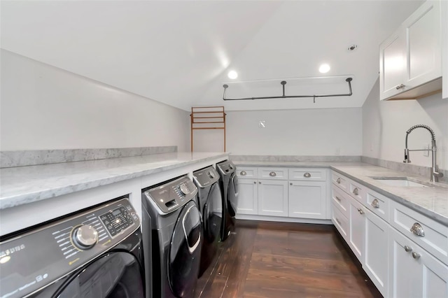 6220 Bayshore Blvd, Tampa, FL 33611 - laundry room featuring washing machine and clothes dryer, cabinet space, and dark wood-style flooring