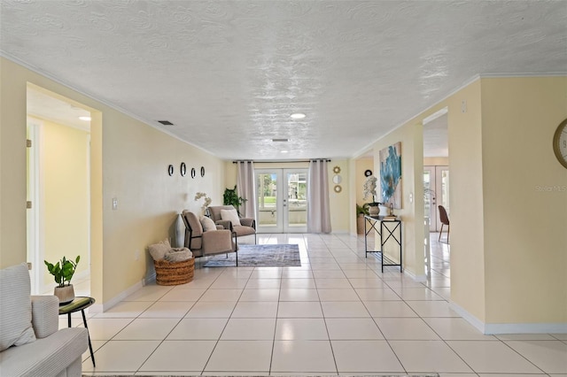 7401 Islander Ln, Hudson, FL 34667 - living area with french doors, a textured ceiling, light tile patterned floors, and crown molding