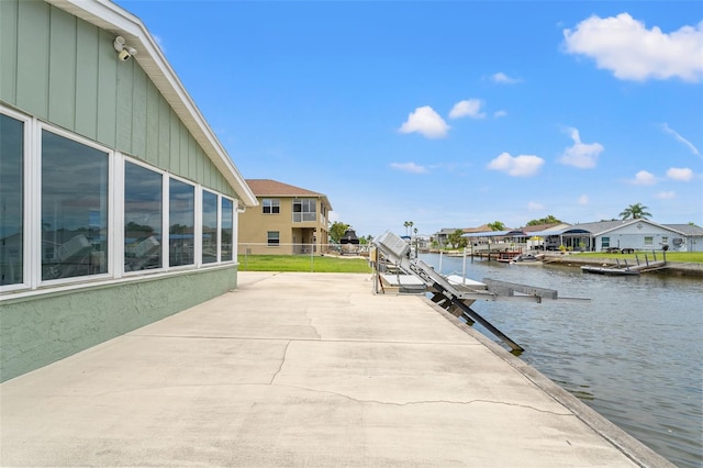7401 Islander Ln, Hudson, FL 34667 - dock area featuring a water view and a residential view