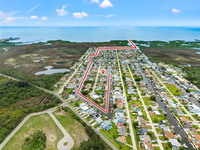 7401 Islander Ln, Hudson, FL 34667 - aerial perspective of suburban area with a large body of water