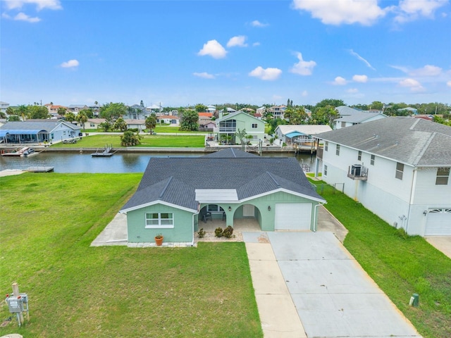7401 Islander Ln, Hudson, FL 34667 - view of front of home with a residential view, driveway, a water view, and a front yard