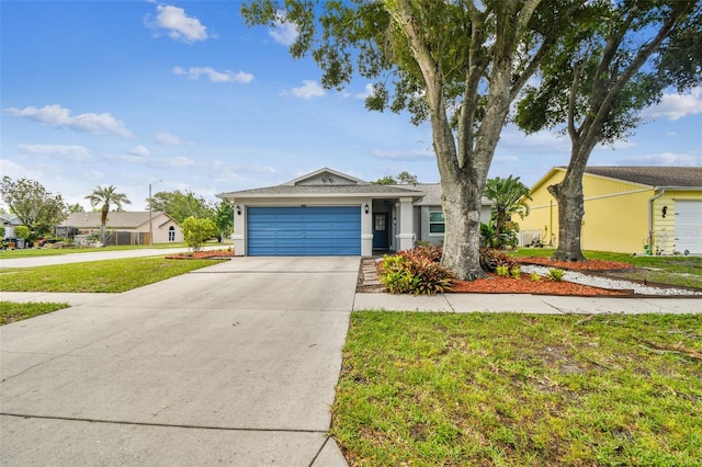 4108 Woodtrail Blvd, New Port Richey, FL 34653 - view of front of property featuring a garage, concrete driveway, a front yard, and stucco siding