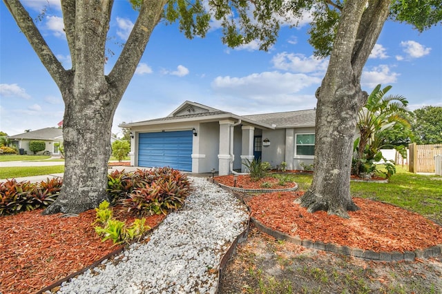 4108 Woodtrail Blvd, New Port Richey, FL 34653 - view of front of property featuring stucco siding and a garage