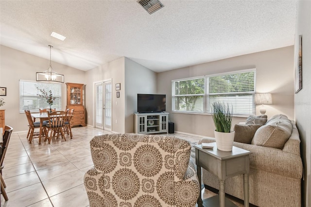 4108 Woodtrail Blvd, New Port Richey, FL 34653 - living room with plenty of natural light, a textured ceiling, lofted ceiling, a chandelier, and light tile patterned flooring