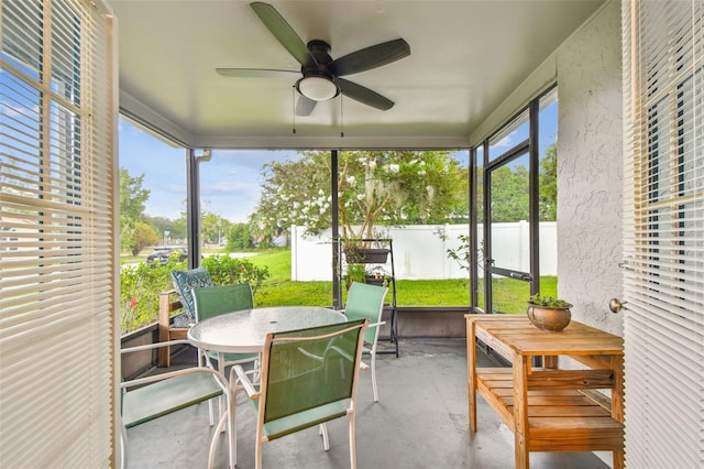 4108 Woodtrail Blvd, New Port Richey, FL 34653 - sunroom featuring ceiling fan and outdoor dining space