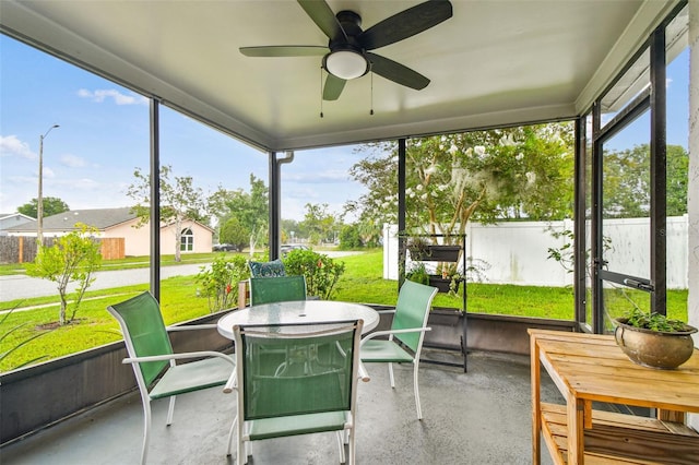 4108 Woodtrail Blvd, New Port Richey, FL 34653 - sunroom with outdoor dining space and a ceiling fan