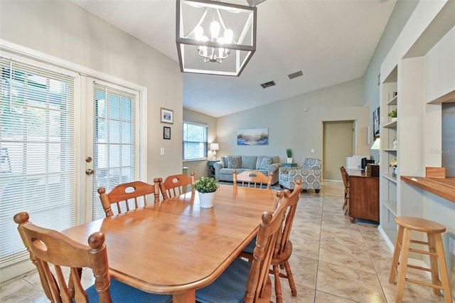 4108 Woodtrail Blvd, New Port Richey, FL 34653 - dining space with vaulted ceiling, a chandelier, and light marble finish flooring