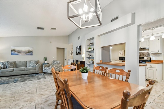 4108 Woodtrail Blvd, New Port Richey, FL 34653 - dining area with lofted ceiling, built in shelves, a chandelier, and light marble finish floors