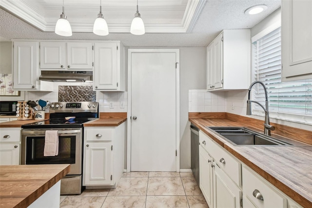 4108 Woodtrail Blvd, New Port Richey, FL 34653 - kitchen featuring stainless steel appliances, wood counters, under cabinet range hood, decorative backsplash, and white cabinetry